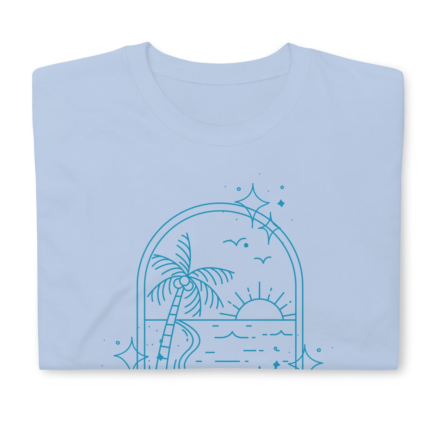 Close-up of folded light blue beach tee with palm tree, sun, and star details