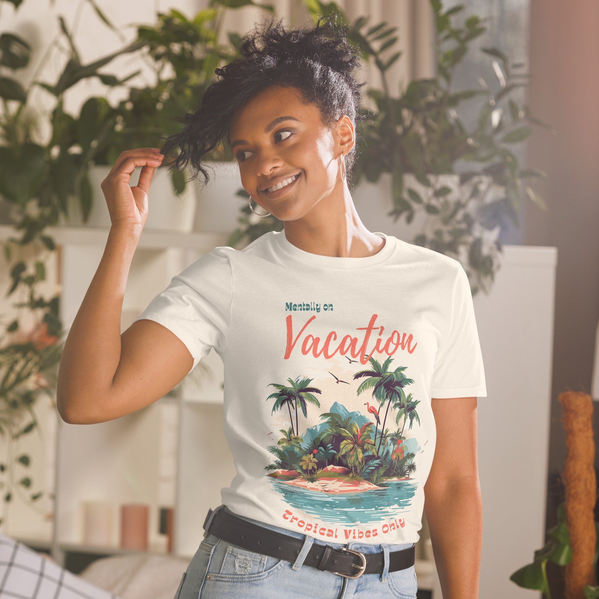 Model wears off-white Tropical Vibes Only beach graphic tee styled with jeans