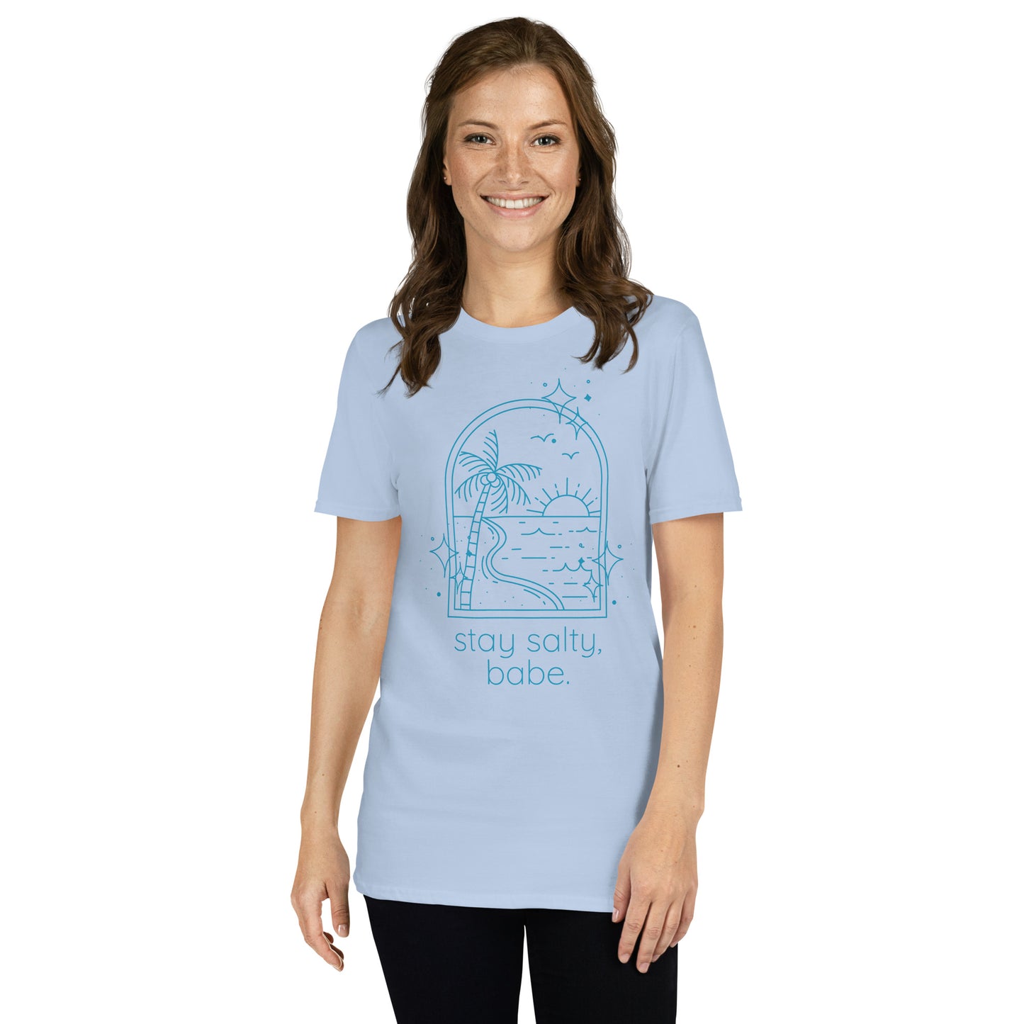 Woman wearing light blue “Stay Salty, Babe” beach graphic tee with relaxed fit