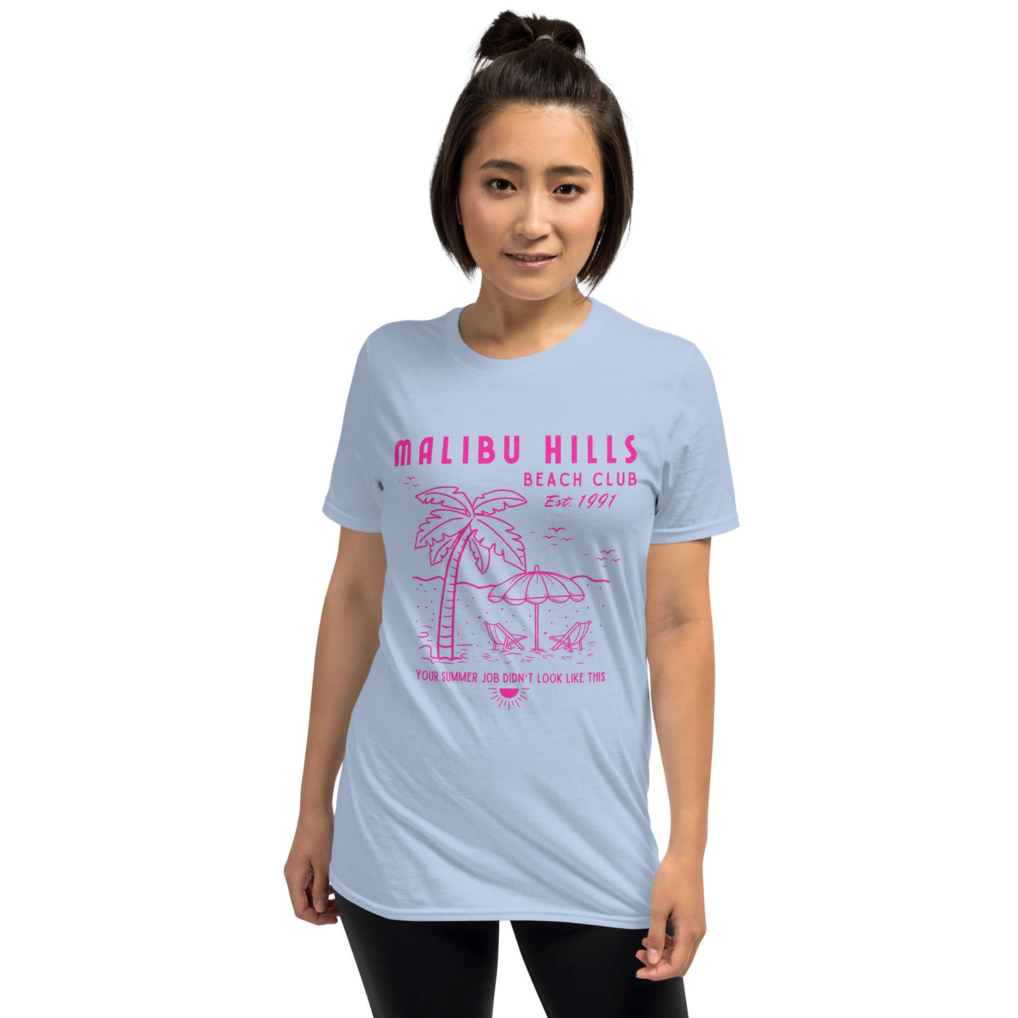 Light blue Malibu Hills Beach Club tee worn by model, featuring nostalgic hot pink beach club graphic