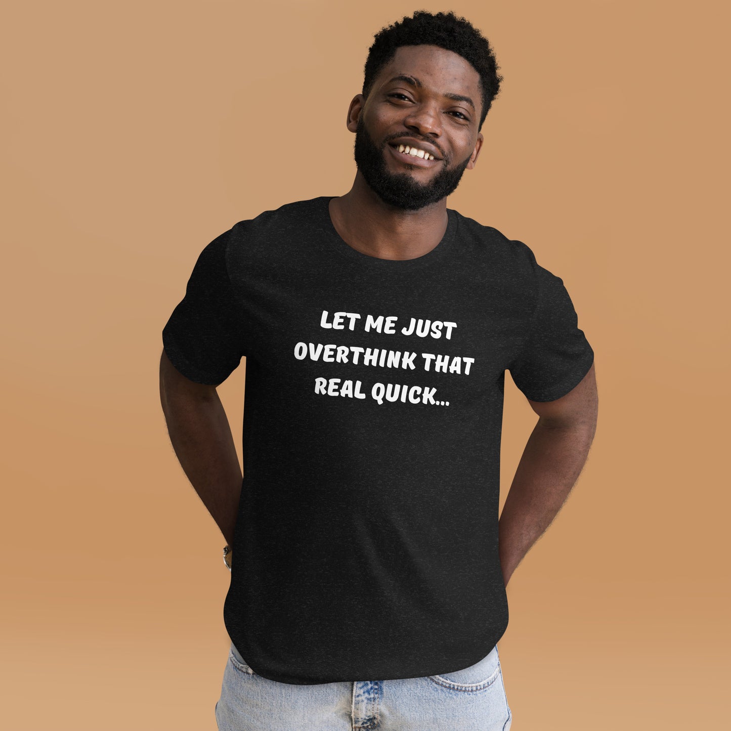 Smiling, bearded man wears a black tee shirt that reads "Let me just overthink that real quick..."