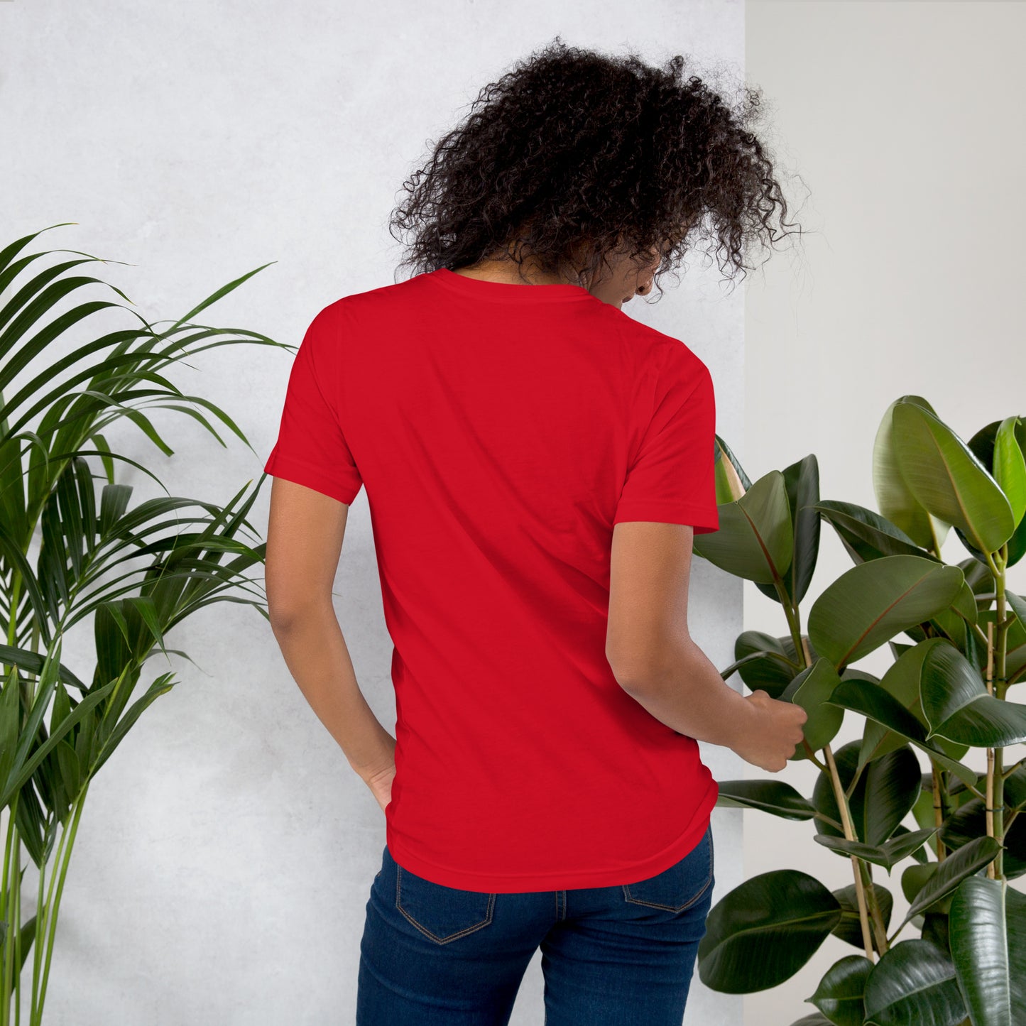 Back view of red unisex Fourth of July tee on female model — relaxed fit with classic crewneck and hip-length style