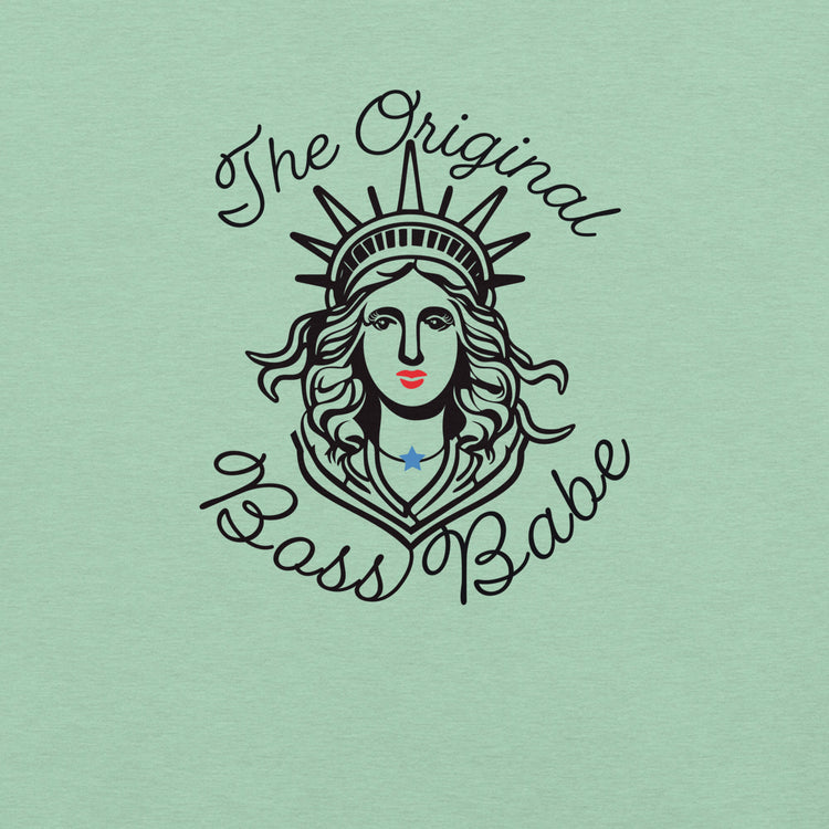 Close-up of Lady Liberty graphic with red lips, flowing hair, and blue star necklace — “Original Boss Babe” feminist shirt design