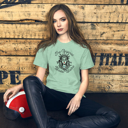 Feminist Fourth of July shirt on woman — heathered mint tee with Lady Liberty graphic and “Original Boss Babe” slogan