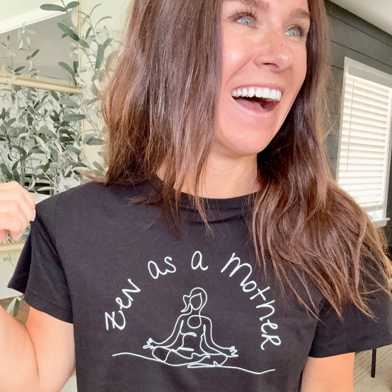 woman wearing black Zen as a Mother graphic tee from Jade Street Market
