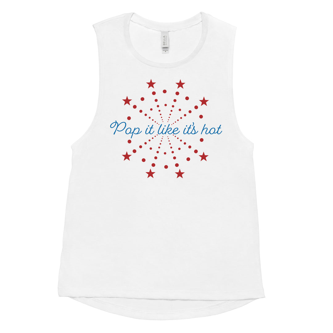 Flat lay of white women’s 4th of July muscle tank with “Pop It Like It’s Hot” red and blue firework graphic