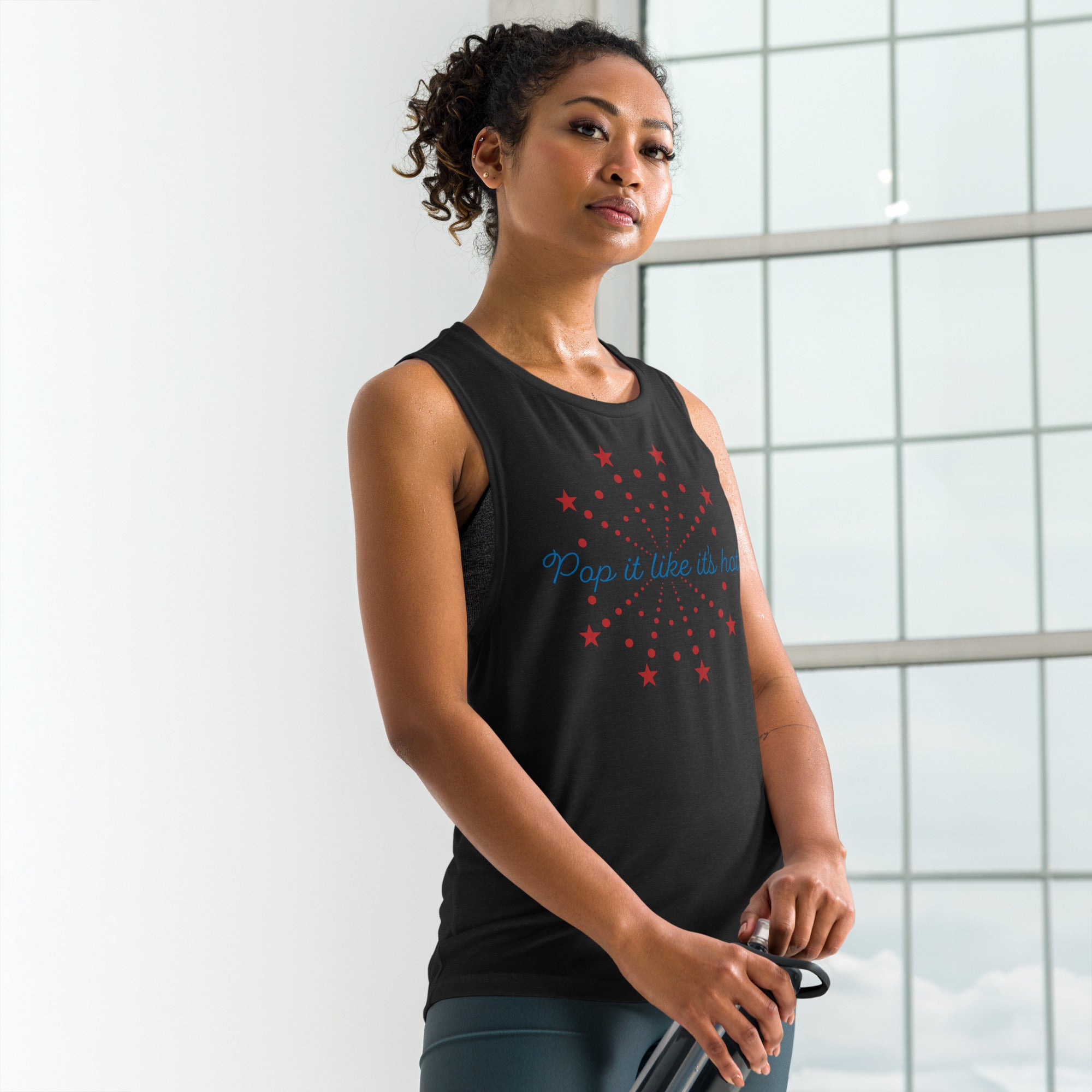 Black Fourth of July tank for women — cheeky “Pop It Like It’s Hot” firework design on relaxed muscle tee
