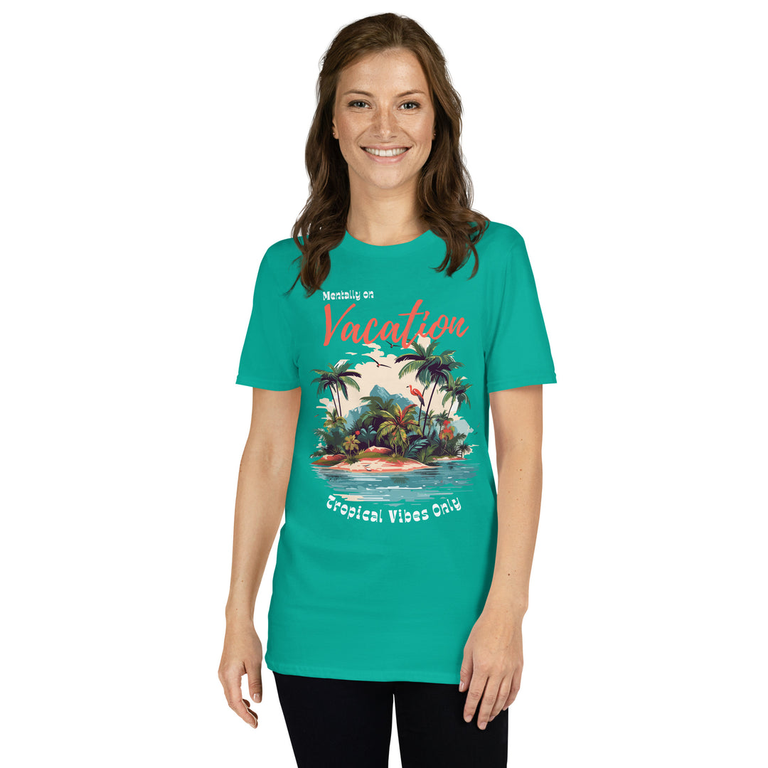 Woman in jade green grapgic tee that reads "Mentally on Vacation" and "Tropical Vibes Only" with an island graphic