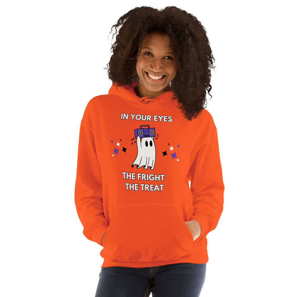 Smiling woman wears festive orange hoodie with a cute ghost holidng a bombox overhead. The caption reads: In Your Eyes; The fright, the treat.