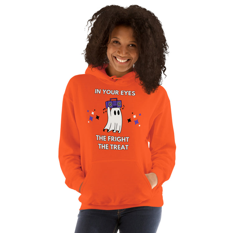 Smiling woman wears festive orange hoodie with a cute ghost holidng a bombox overhead. The caption reads: In Your Eyes; The fright, the treat.