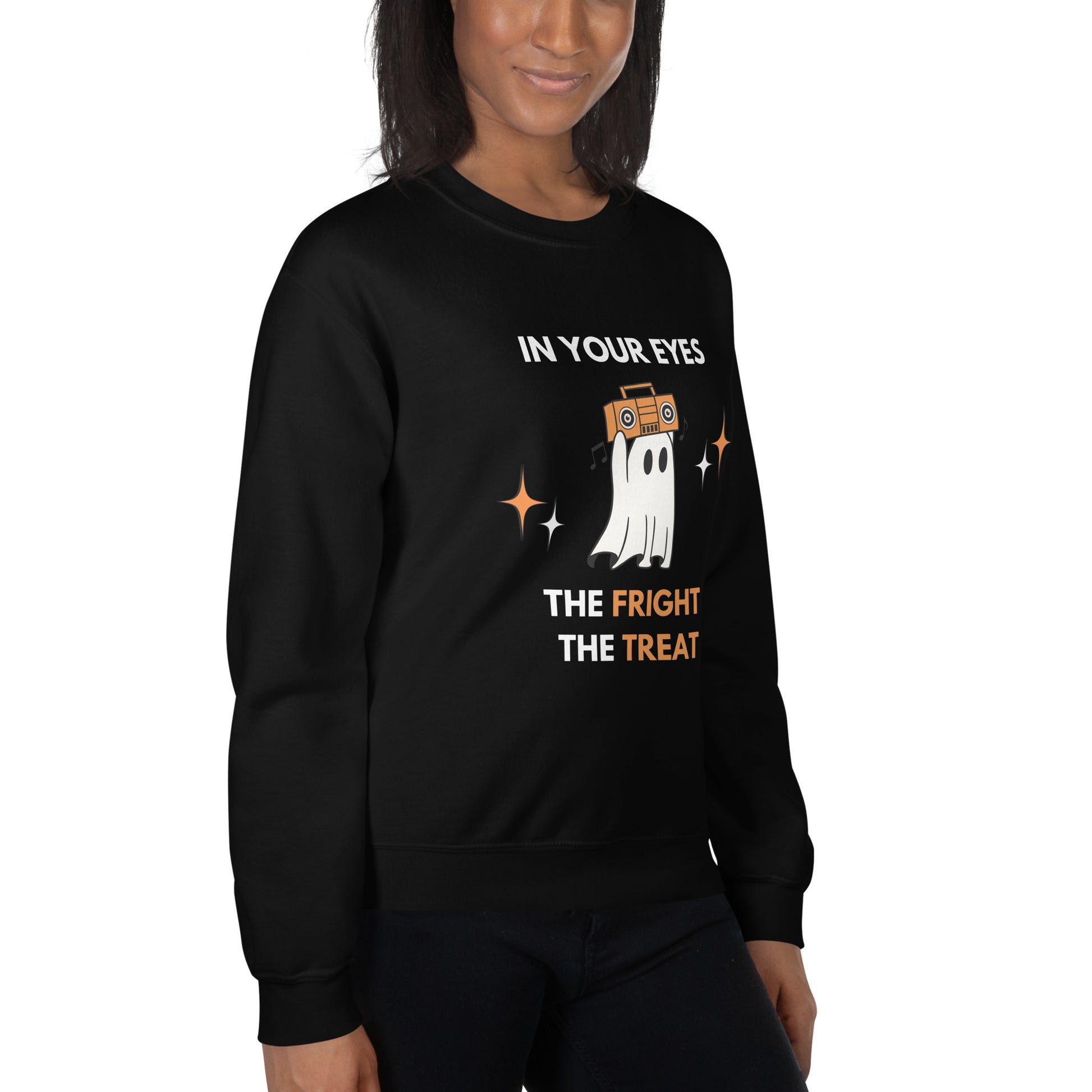 Woman wears a Halloween sweatshirt featuring a ghost holding an orange boombox overhead, Say Anything style. The shirt reads "In your eyes - The Fright, The Treat."