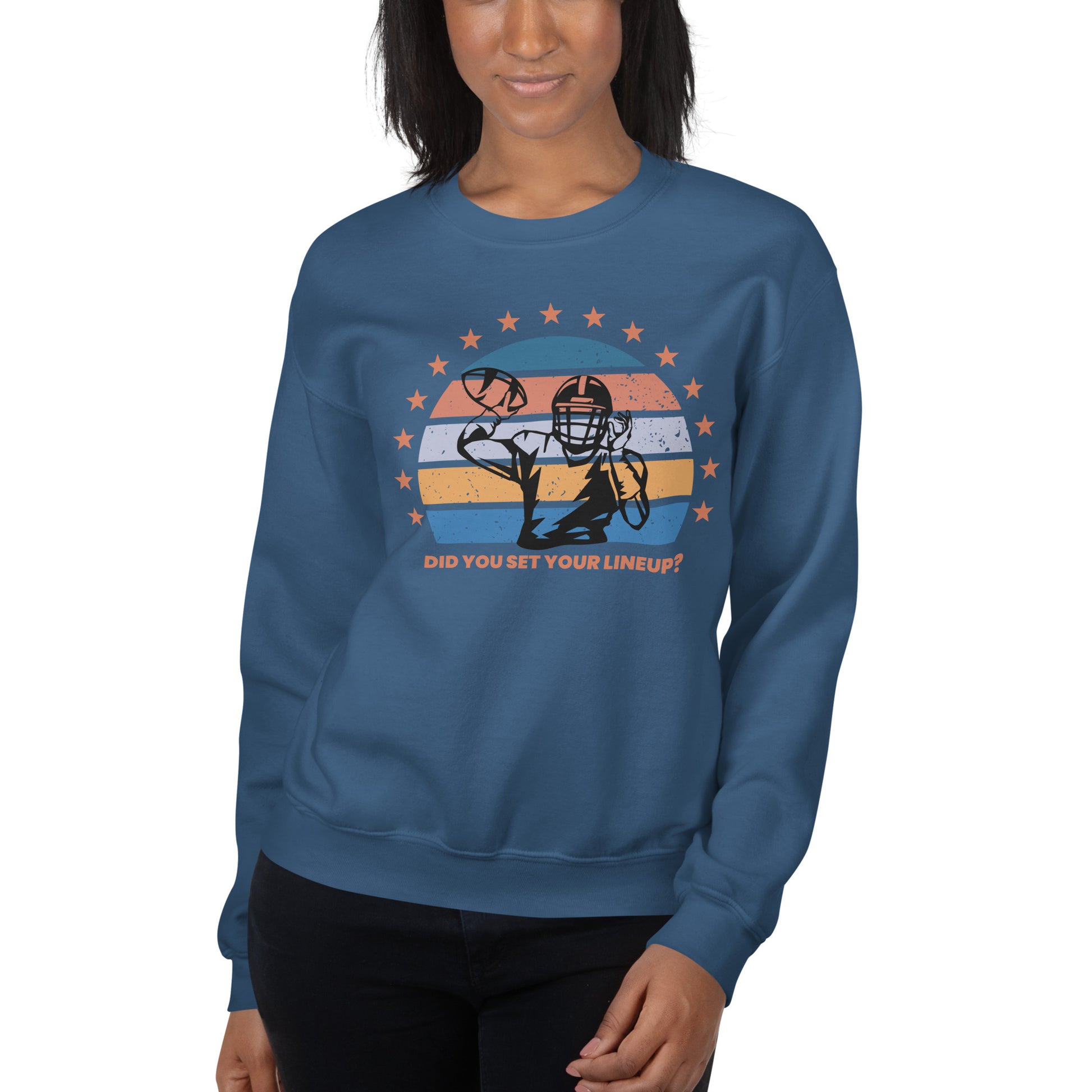 Young woman wears a fantasy football sweatshirt that reads "Did you set your line up?" The sweatshirt has a silhouette of a quarterback about the throw a football with a distressed backdrop of yellow, blues, and light pink and a star border.