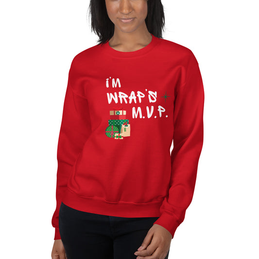 Woman models bright right red crewneck sweatshirt with white text reading 'I'M WRAPs M.V.P.' and festive gift icons. A humorous Christmas play on words for holiday gift-wrapping enthusiasts.