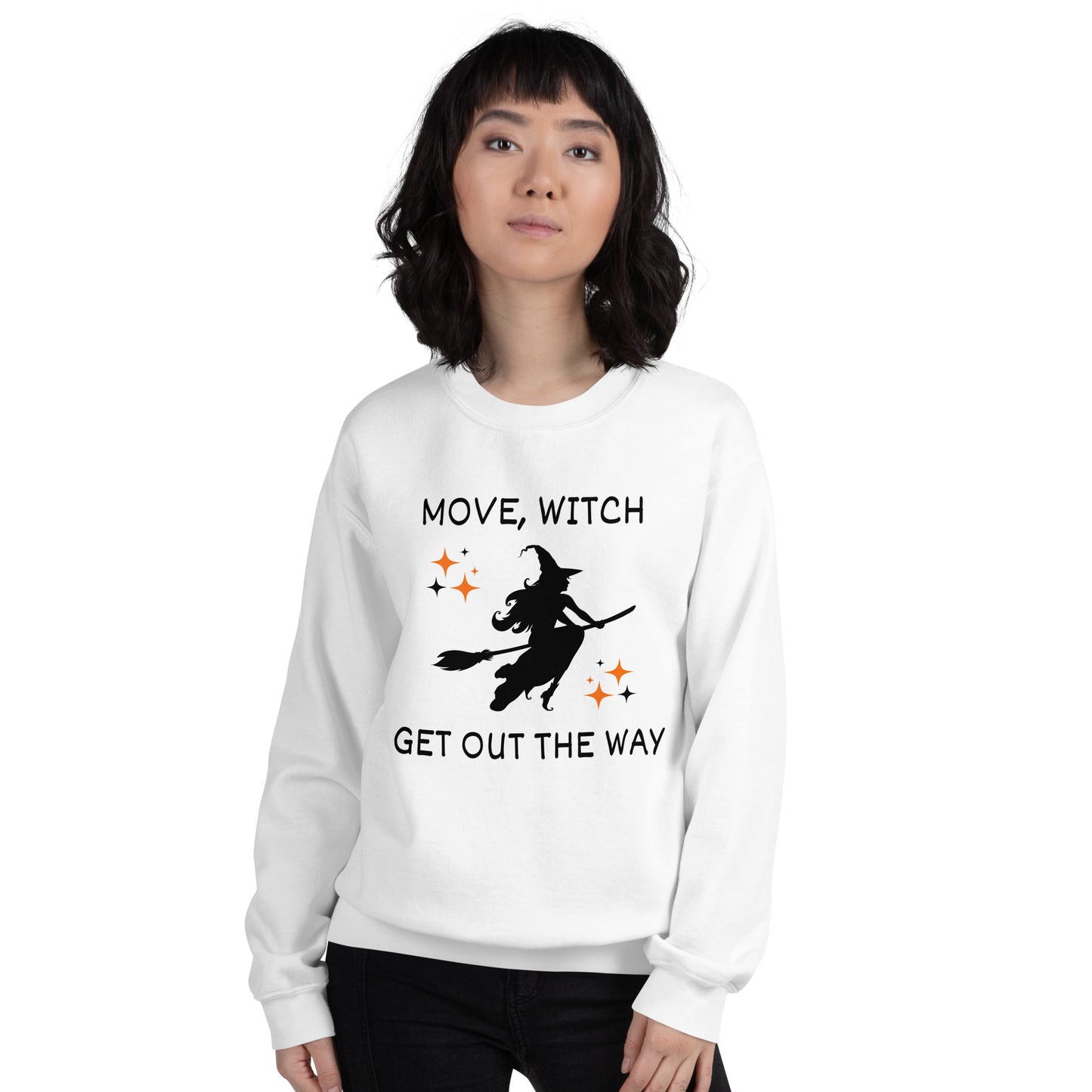 Woman wears white Halloween sweatshirt with the white silhouette of a witch on a broomstick. The shirt says "Move, Witch Get out the way".