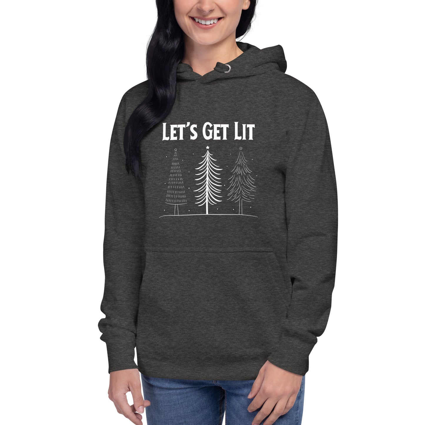 Smiling woman wears a charcoal gray holiday hoodie  with the text "Let's Get Lit" printed on it, along with a graphic of three Christmas trees. 