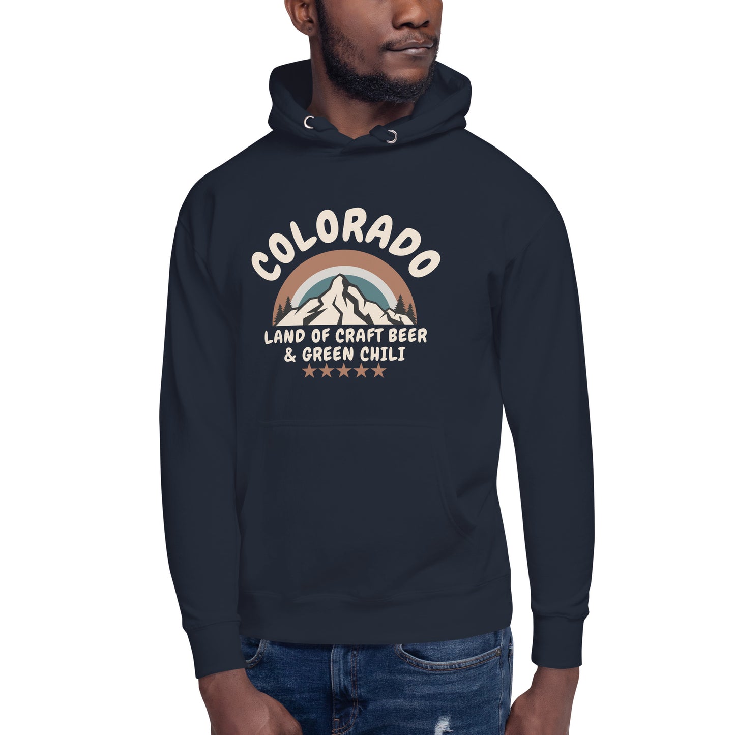 A man wearing blue jeans and a navy blue hoodie with a retro-style mountain design celebrating Colorado craft beer and green chili.