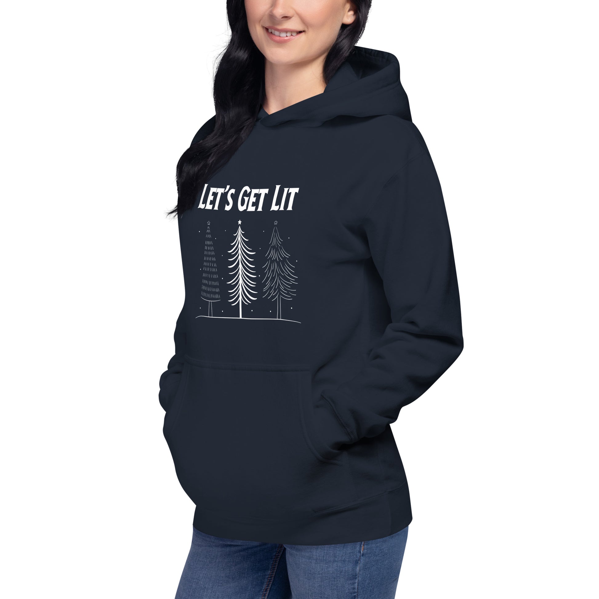 A woman wears a navy hooded sweatshirt with the text "Let's Get Lit" printed on it, along with a graphic of three Christmas trees. The sweatshirt appears to be a casual, holiday-themed clothing item.