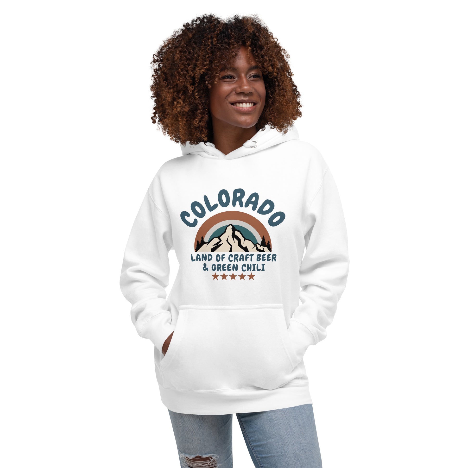 Smiling woman wearing a white  hoodie with a retro-style mountain design celebrating Colorado craft beer and green chili.