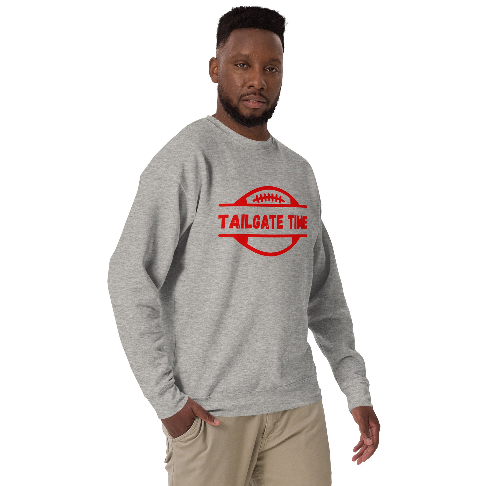 Man wears a gray football sweatshirt with Chiefs red graphics. The gray crewneck displays a red football graphic with the word "tailgate time" in a distressed font.