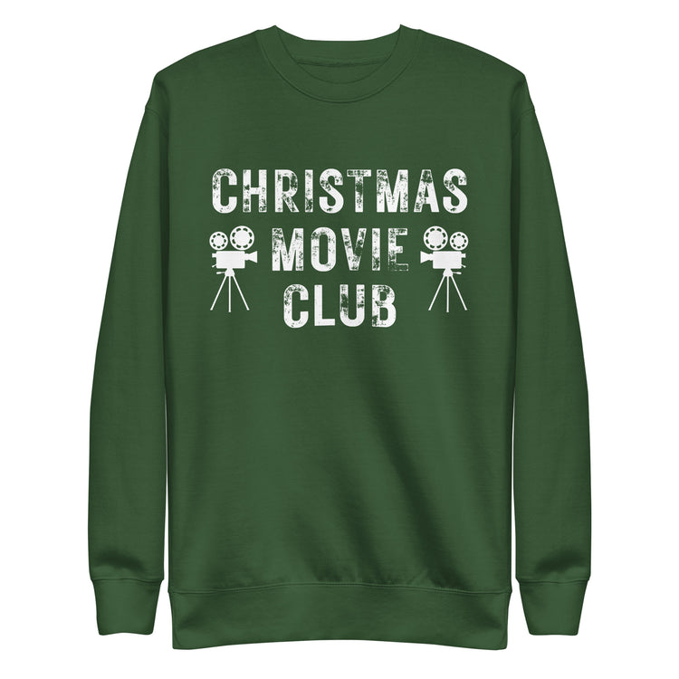 Forest green crewneck sweatshirt with distressed white text reading 'CHRISTMAS MOVIE CLUB', decorated with retro movie camera icons. Perfect for holiday movie marathons.