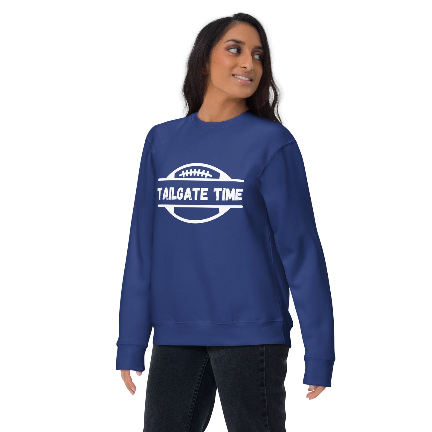 Woman wears a bright blue football sweatshirt. The blue crewneck displays a white football graphic with the word "tailgate time" in a distressed font.