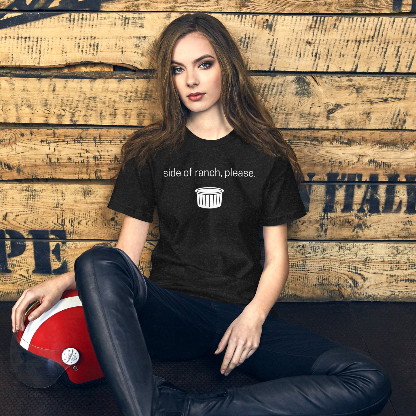 Woman with long brown hair wears a black graphic tee that says "Side of ranch, please." accompanied by a white ramekin.  