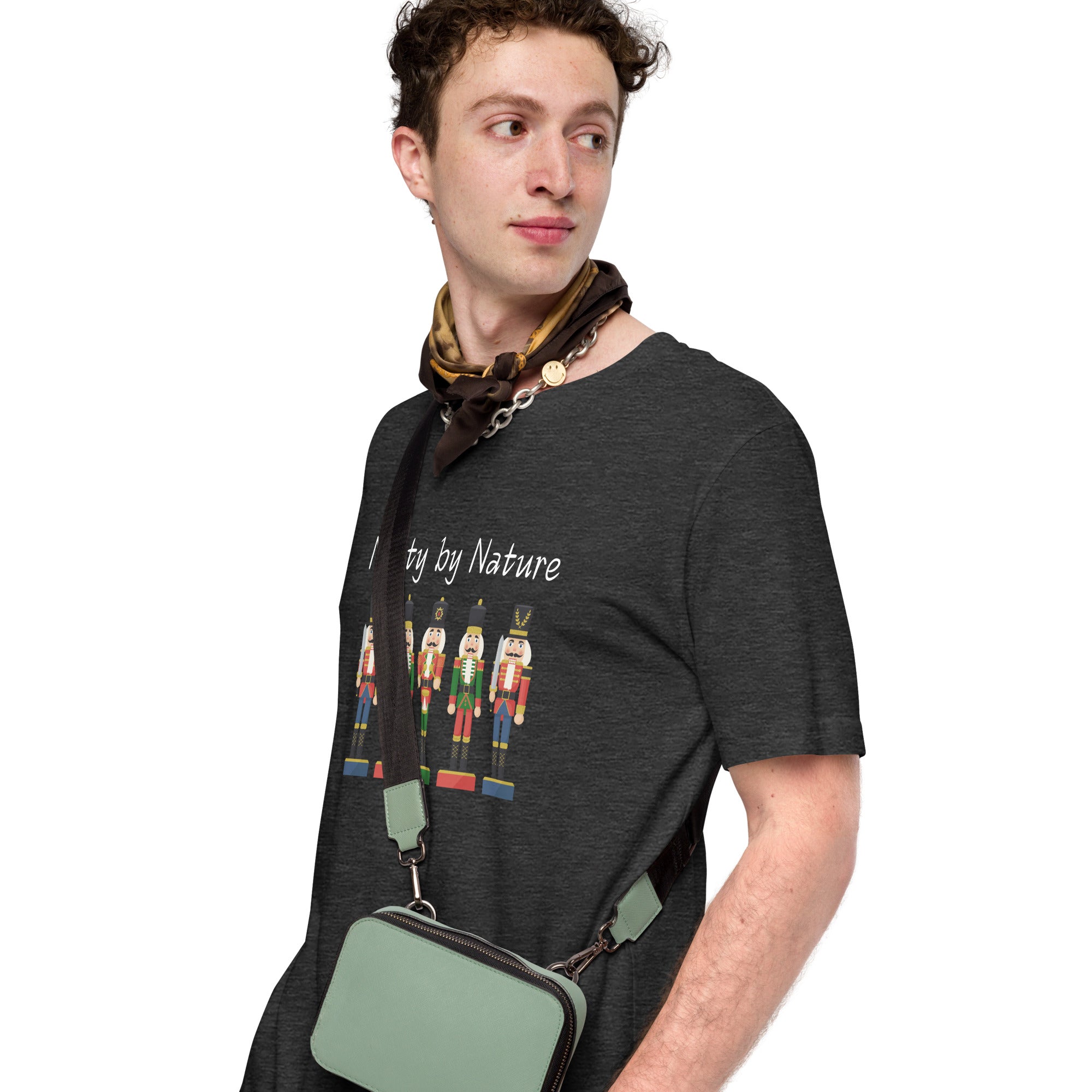 Man wears festive and playful holiday shirt featuring five nutcrackers and text that reads "Nutty by Nature"