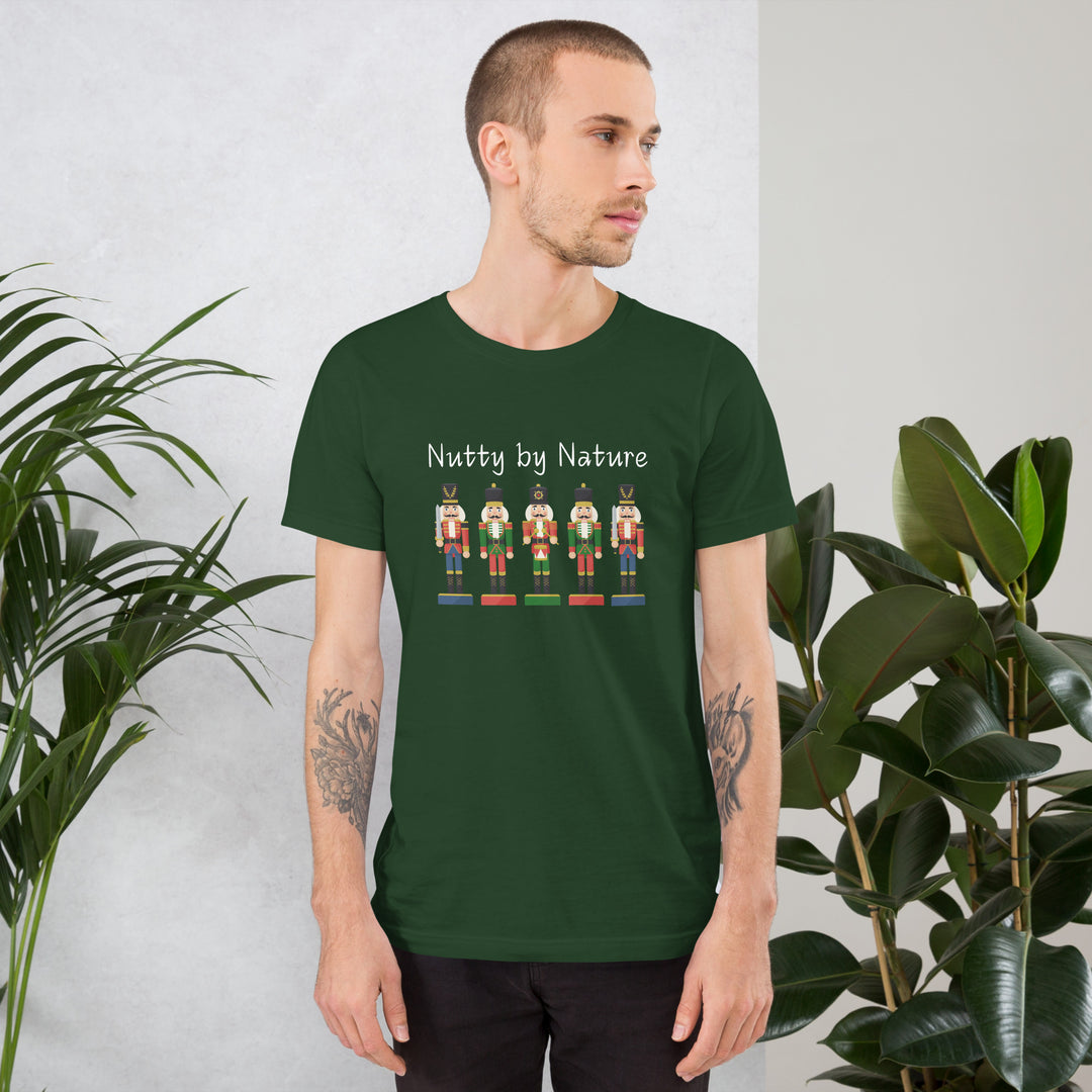 Man wears festive and playful holiday shirt featuring five nutcrackers and text that reads "Nutty by Nature"