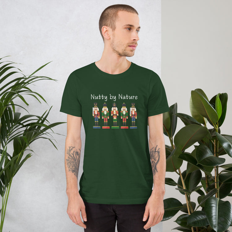 Man wears festive and playful holiday shirt featuring five nutcrackers and text that reads "Nutty by Nature"