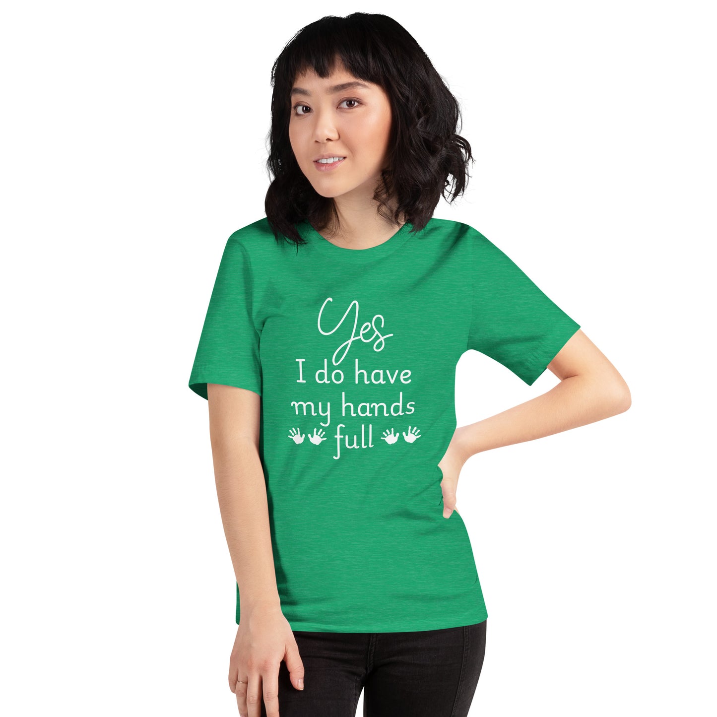 Smiling woman wears kelly green tee that says 'Yes, I do have my hands full' with two sets of child handprints.