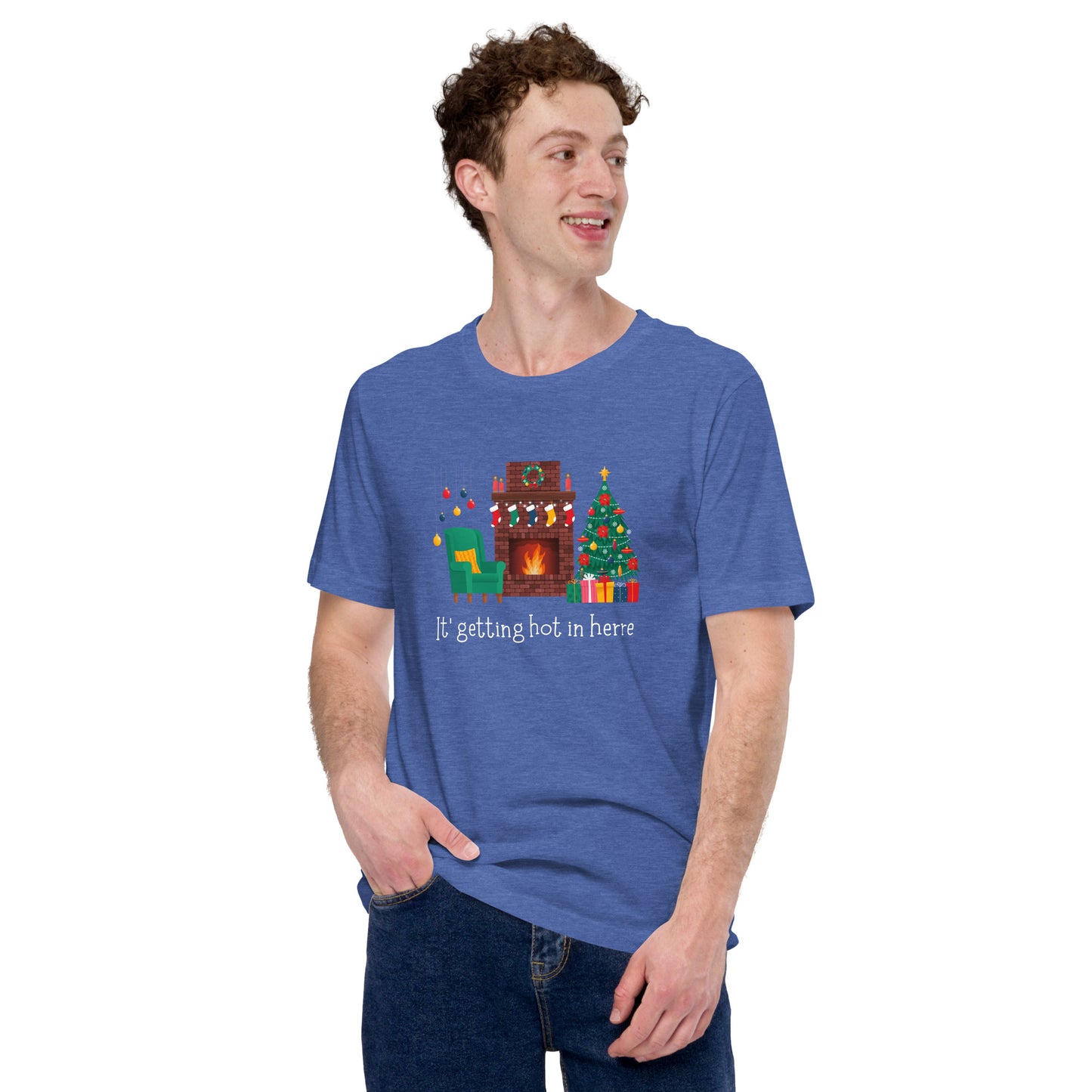 Man wears festive holiday tee shirt that reads "It's getting hot in herre". The design is a cozy Christmas living room with holiday decorations and a roaring fireplace.