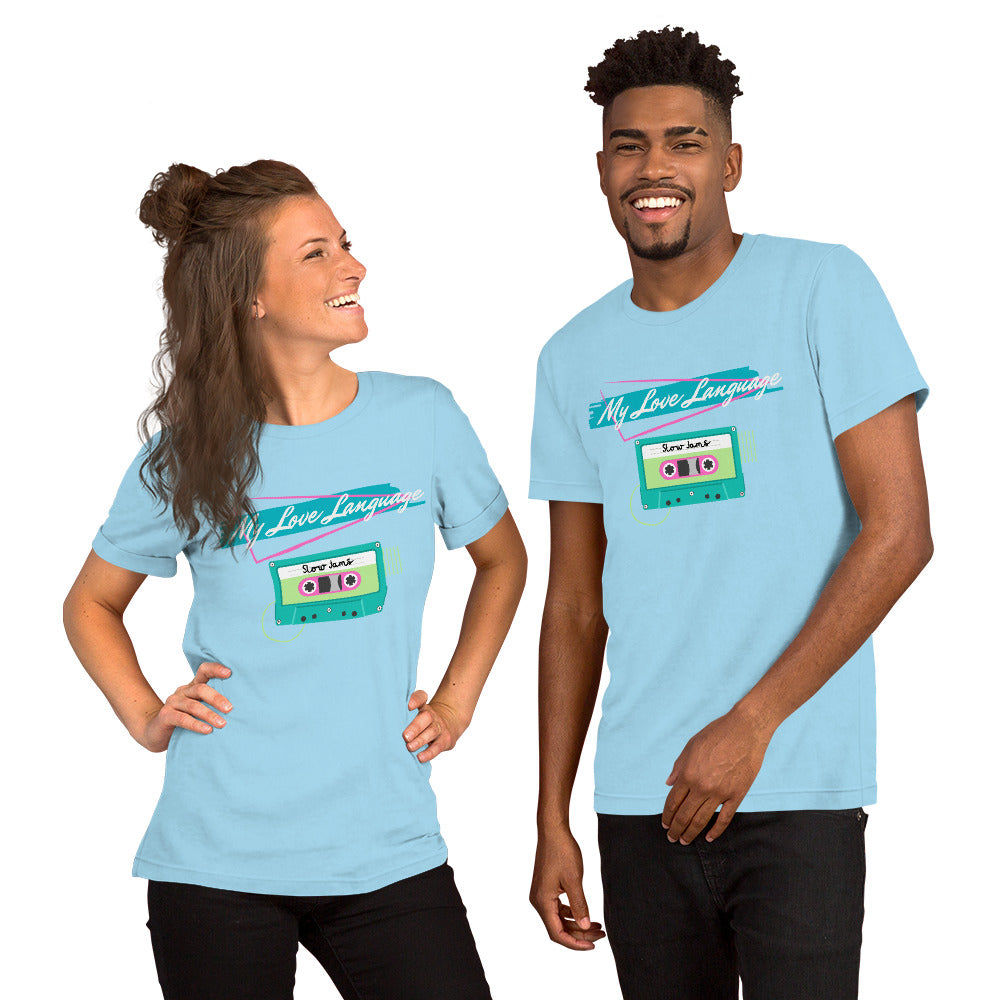 A couple wears matching baby blue tee shorts while smiling, The shirts have bright 80s and 90s styling and read "My LOVE LANGUAGE". It features a cassette tape referencing an old school mixtape.