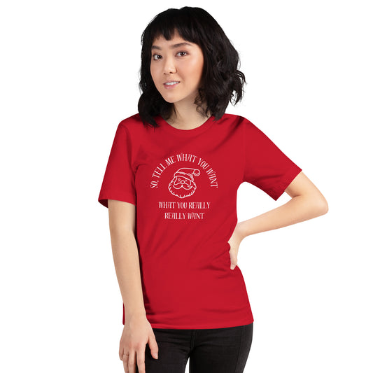 Woman wears festive unisex tee shirt featuring Santa's face and the text "So Tell Me What You Want What You Really Really Want"