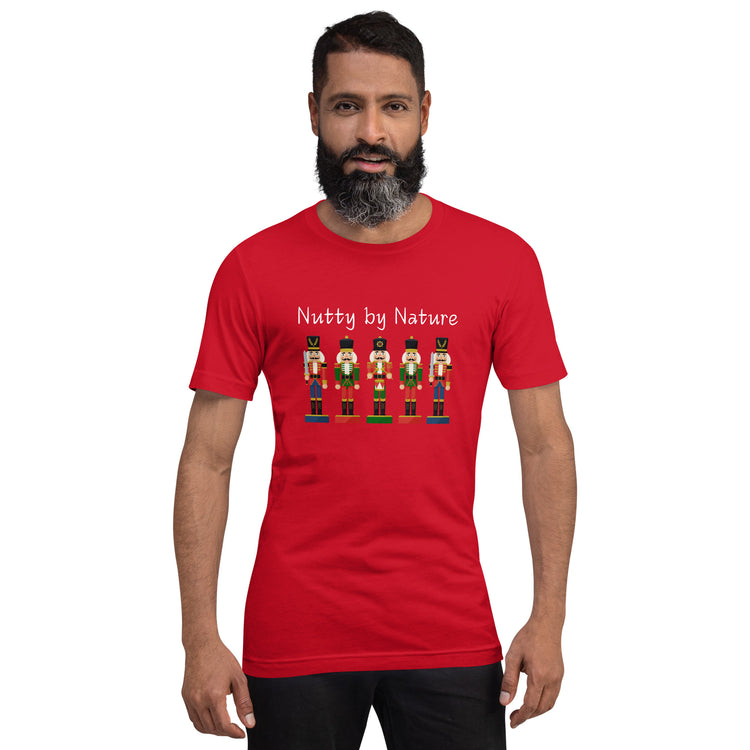 Man wears festive and playful holiday shirt featuring five nutcrackers and text that reads "Nutty by Nature"