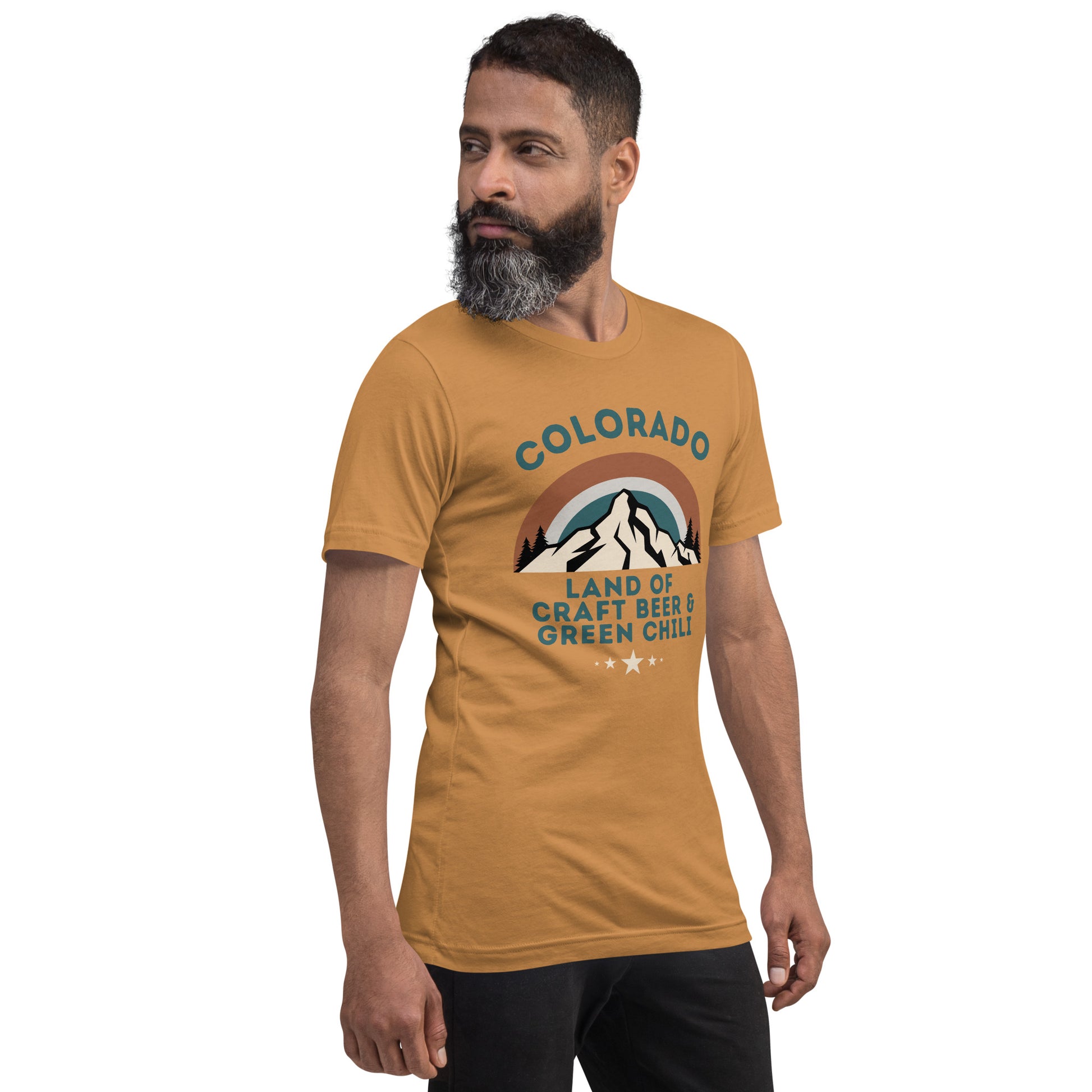 Bearded man with dark hair wears a graphic tee that says "COLORADO: Land of Craft Beer & Green Chili".  The shirt includes a scenic view of the mountains with a colorful sky.