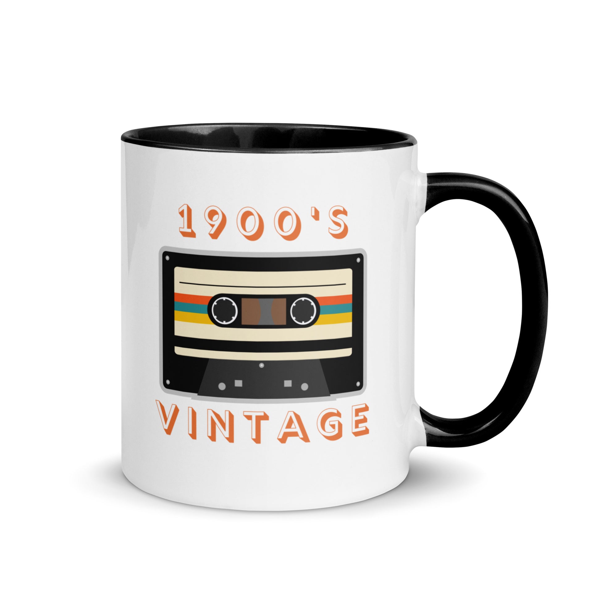 White ceramic mug with black interior and a black handle sits against a white background. It displays a retro looking cassette tape and the words "1900s VINTAGE". A Jade Street Market original mug.