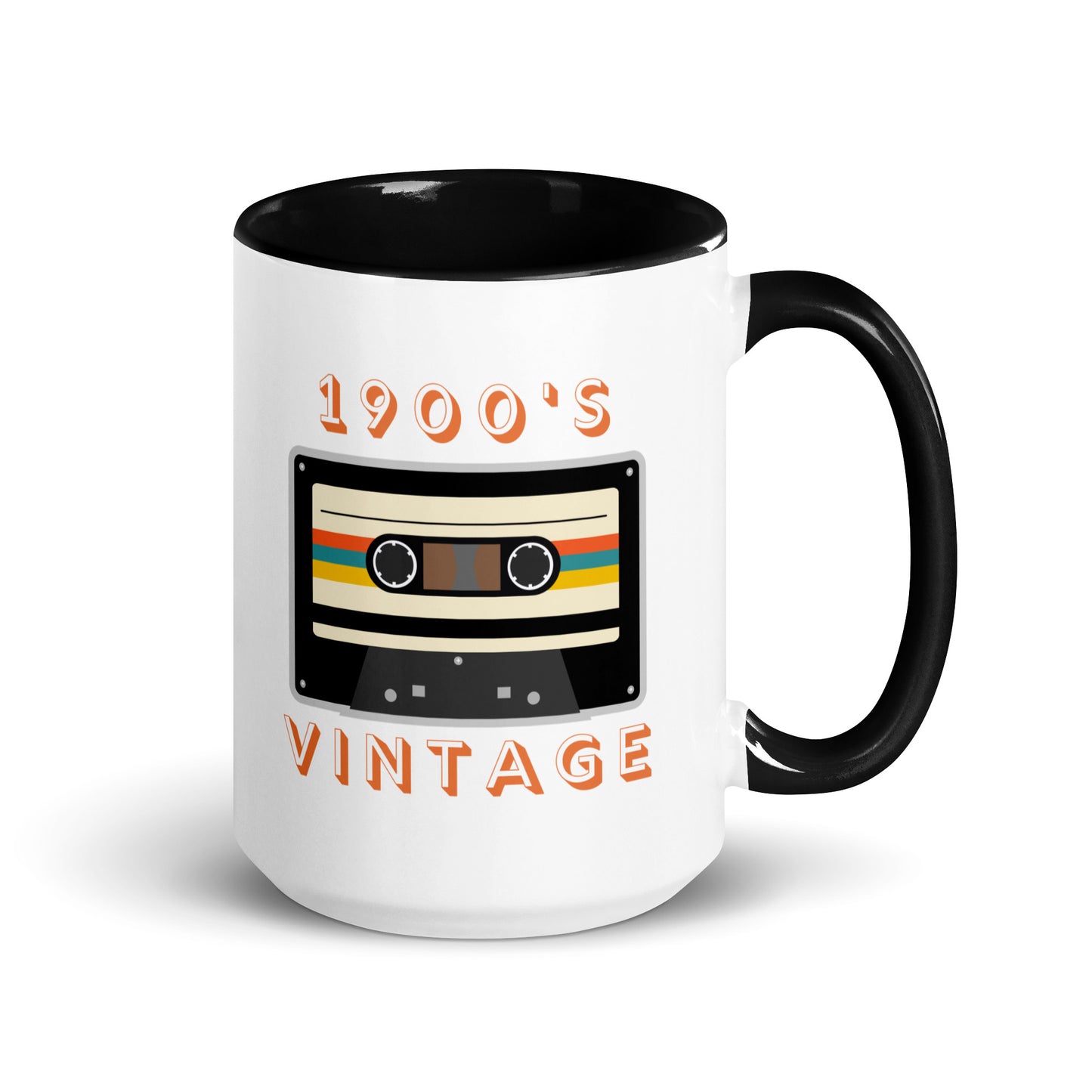 White ceramic mug with black interior and a black handle sits against a white surface. It displays a retro looking cassette tape and the words "1900s VINTAGE". A Jade Street Market original mug.