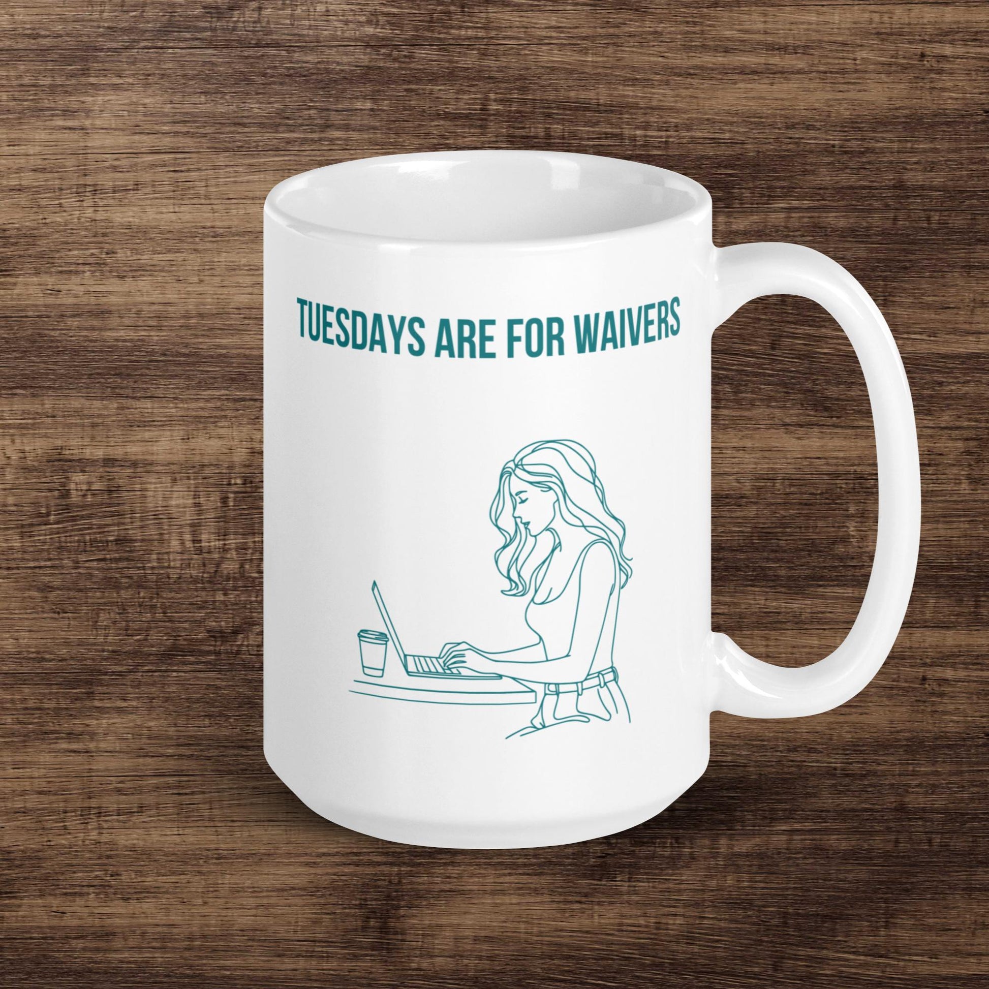 White ceramic mug displays line art of woman working on a laptop. The text reads "TUESDAYS ARE FOR WAIVERS" indicating that she is researching her fantasy football team options and lining up her waiver wire before the Tuesday night deadline. Mug sits against a wood grain backdrop.