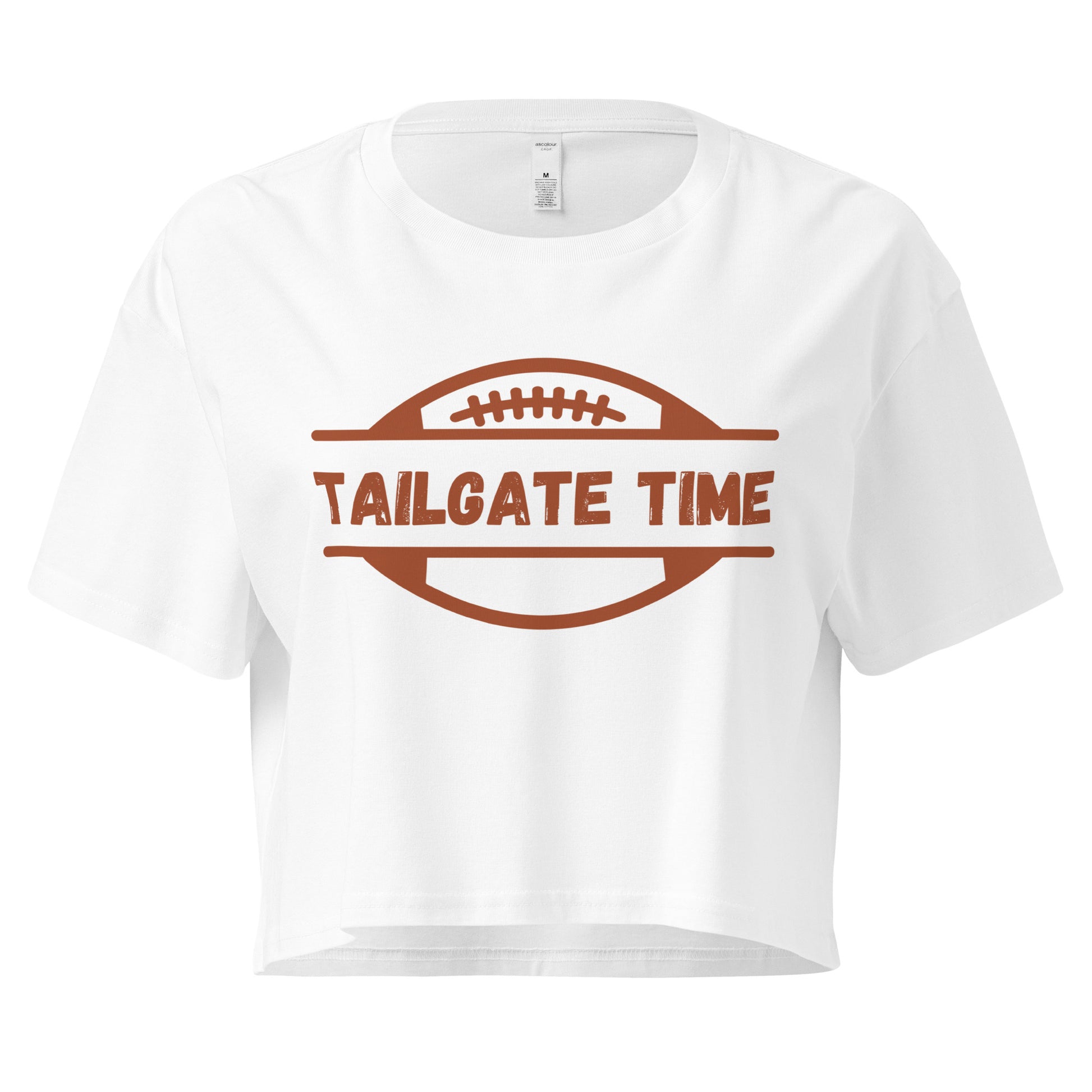 Women's football crop top displays a football and the words "Tailgate Time" in distressed lettering.