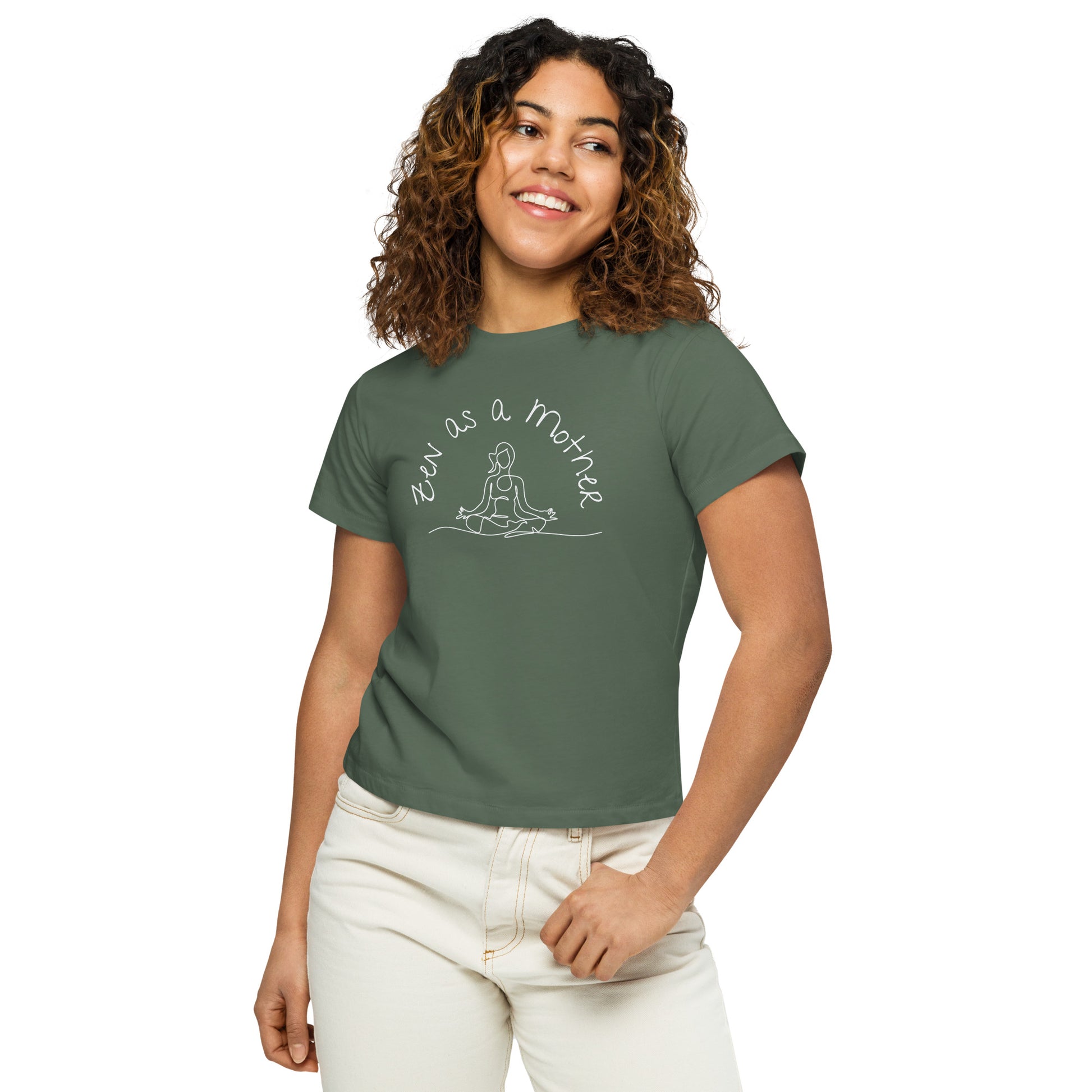 Woman wearing pine green "Zen As a Mother" graphic tee, smiling in a relaxed casual pose