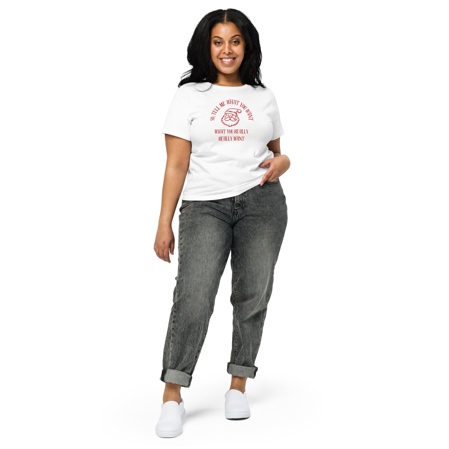 A woman models a festive white mid-length t-shirt featuring Santa's face and the text "So Tell Me What You Want What You Really Really Want" in red.