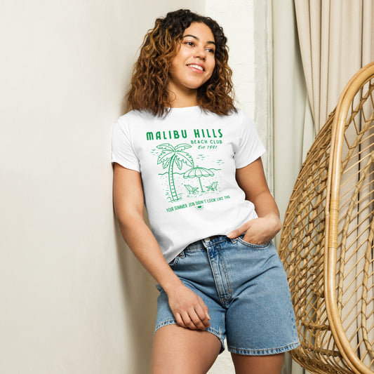 Model wearing white Malibu Hills Beach Club baby tee with green graphic, styled with jean shorts