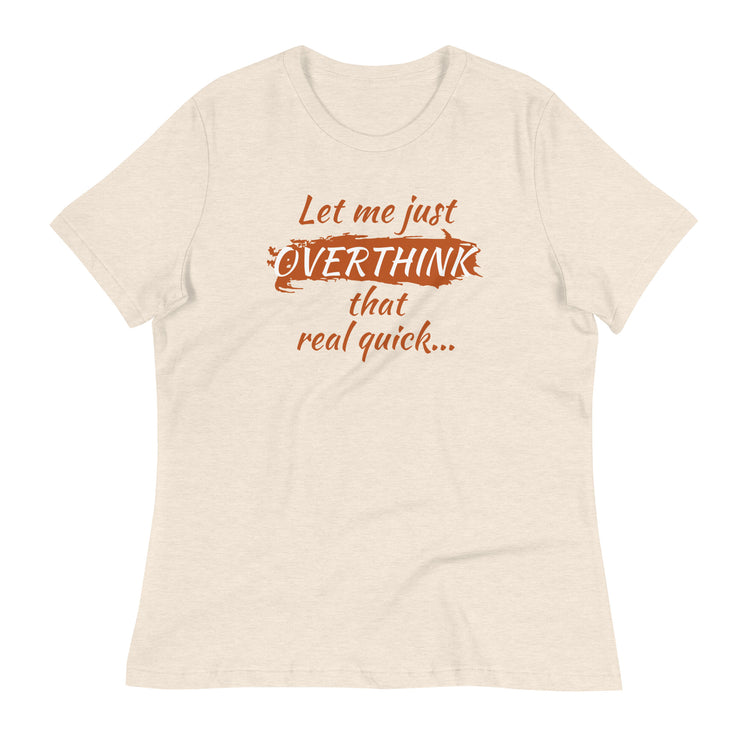 Flat lay of a cream-colored tee with retro burnt orange lettering — "Let me just overthink that real quick" shirt for overthinkers.