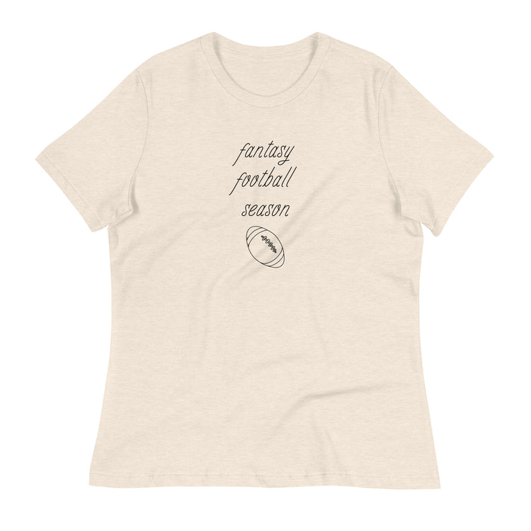Heathered off-white women's tee shirt that reads "FANTASY FOOTBALL SEASON" along with an image of a football. The font is a thin and flowy cursive that is pretty and feminine.