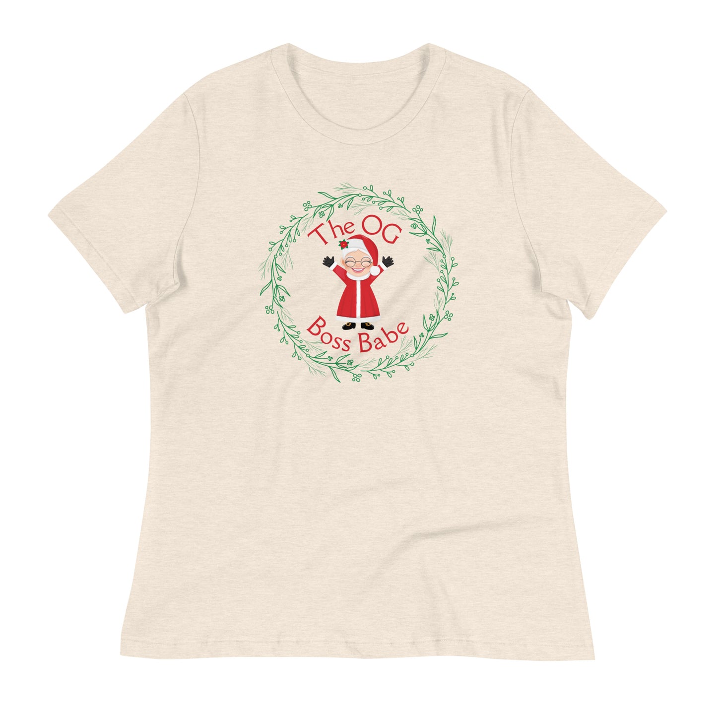 A heathered off-white t-shirt with a circular graphic featuring Mrs. Claus along with the text "The OG Boss Babe" printed inside a wreath design.