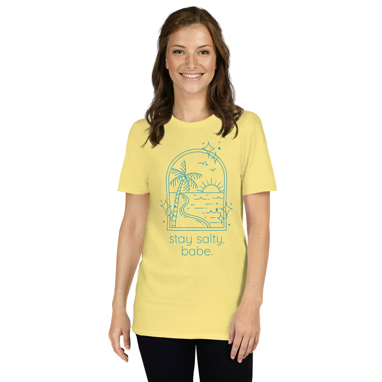 Bright yellow “Stay Salty, Babe” tee with blue graphics on female model with casual summer look