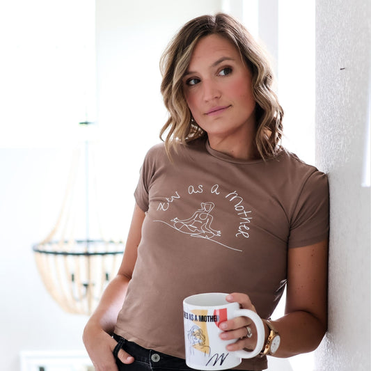 Woman casually holds coffee mug while sporting a cute Zen as a Mother t-shirt